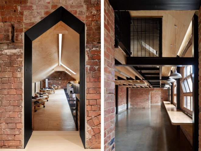 existing brick structures framing doorway and modern office interior