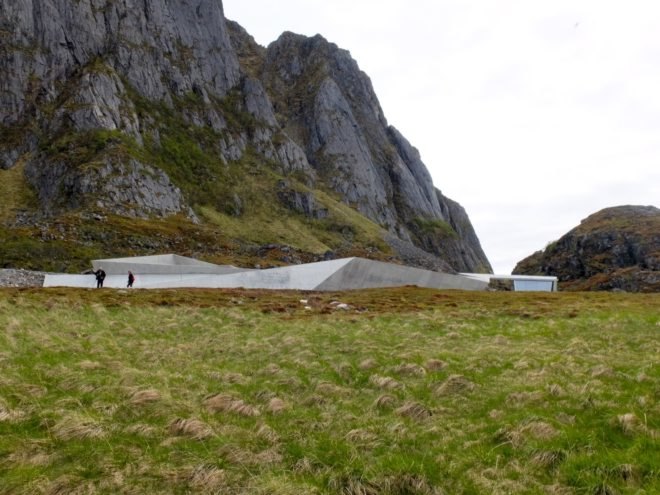 Concrete service facility at base of mountains