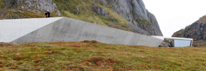 Concrete service facility at base of mountains