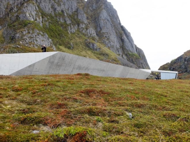 Concrete service facility at base of mountains