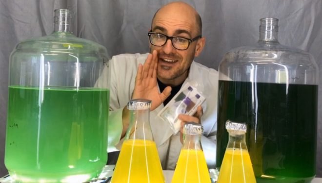 Matthew Huber, Chief Scientist at Algae Research and Supply, poses with Soil Algae products