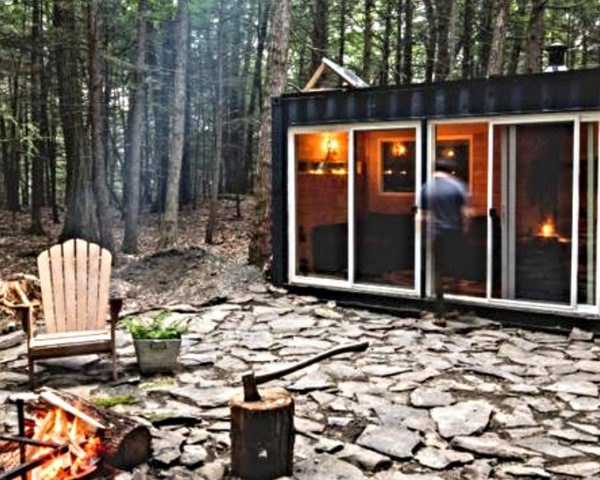 man walking into cabin
