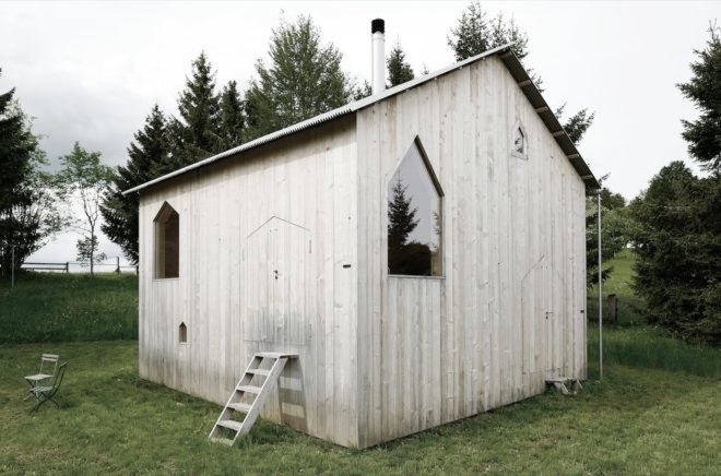 Timber chalet with many of its gabled windows and entrances closed