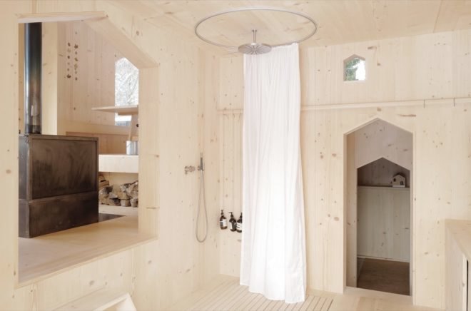 Shower head from the ceiling with circular white curtain