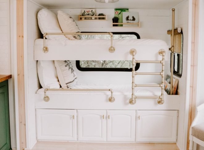 two bunk beds with white linens