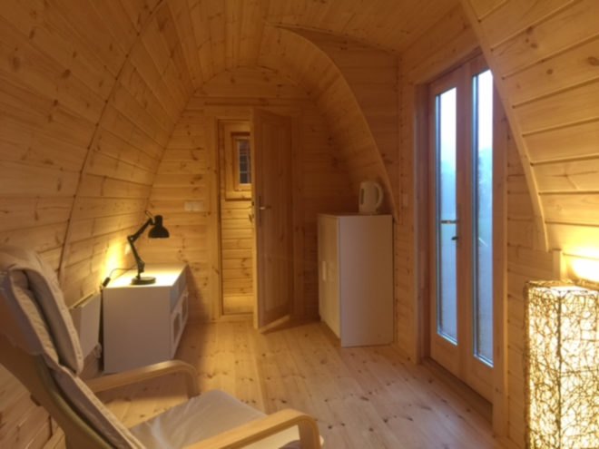 a wood clad interior with double doors