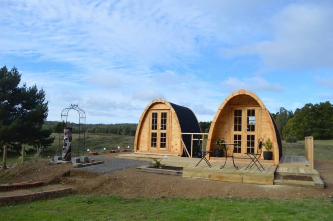 a series of extended curved cabins connected by a deck