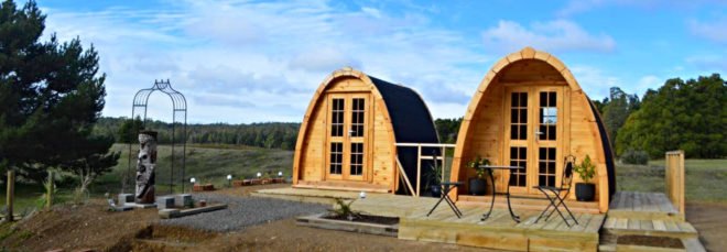 a series of extended curved cabins connected by a deck