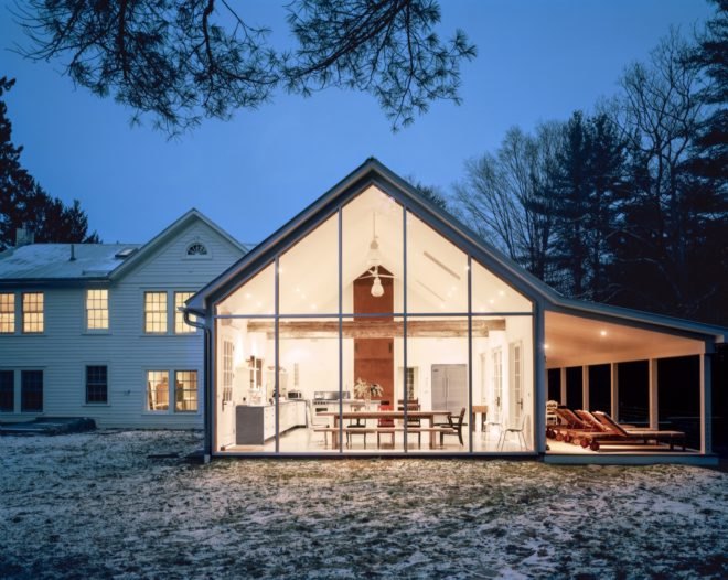 Fully glazed wall lit from within at night