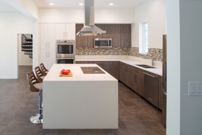 side view of modern kitchen with white kitchen island