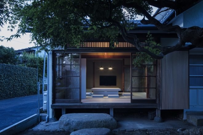 exterior view of home with open wall offering a look into the home