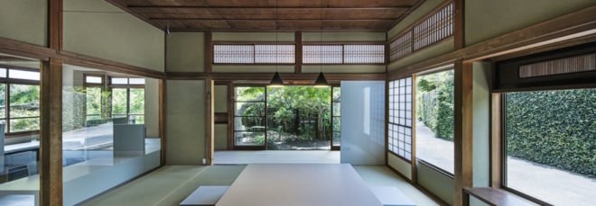 traditional japanese room with long rectangular table and flat floor seating