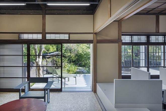 interior of home with large sliding door leading out to patio area and garden