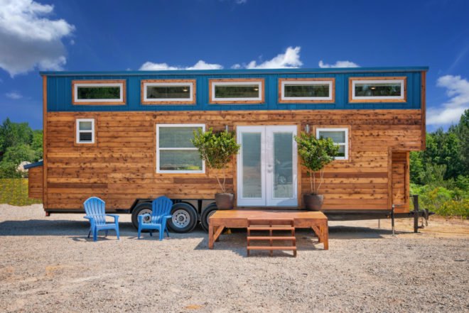 cedar tiny home with blue accents