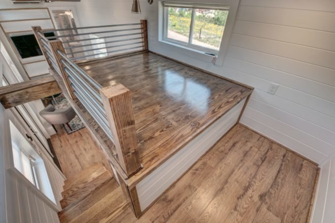 loft area with wooden flooring