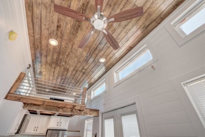 wooden ceiling with fan
