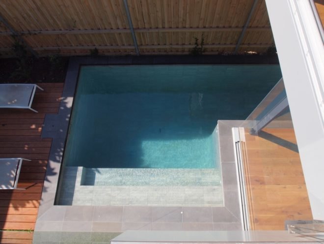 lap pool with steps leading down to water