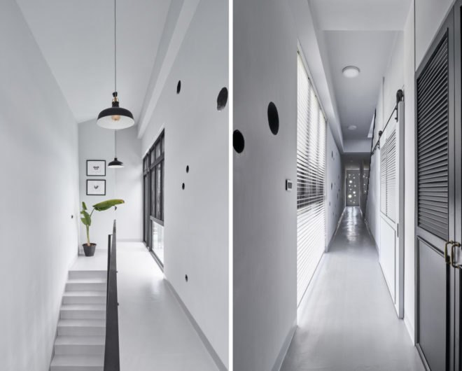 all white interior hallway with black accents
