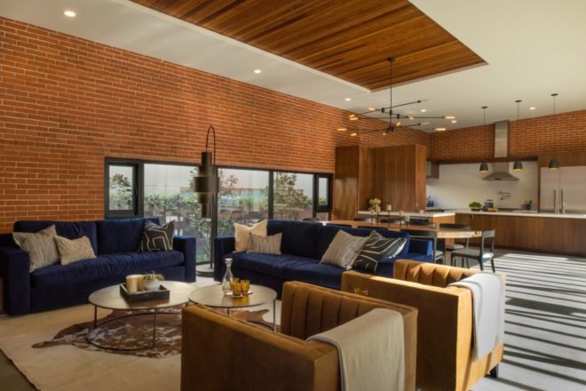 a living space with large sofa and chairs