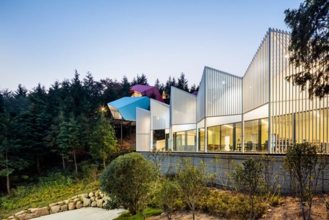 a white building with glass facade