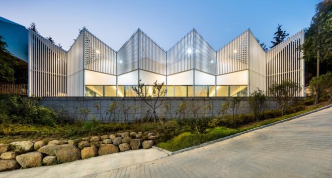 a white building with glass facade