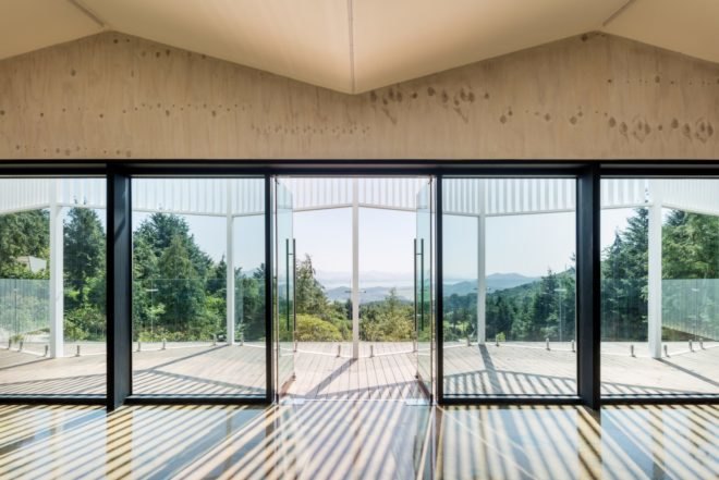 glass foors looking out over a forest