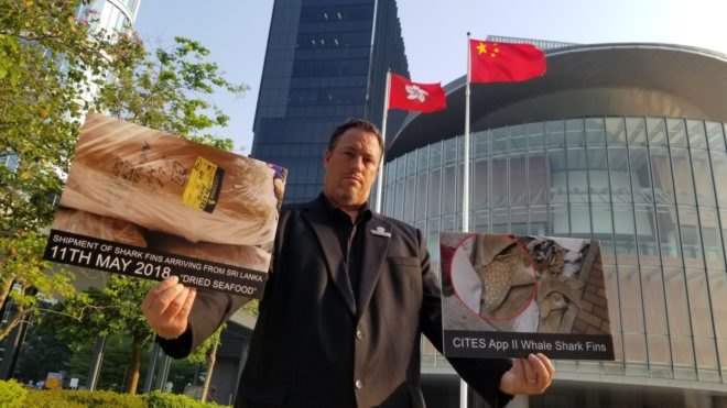 Sea Shepherd Asia Director Gary Stokes with photographs