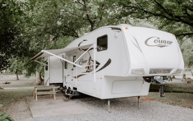 white camper van with fold out shade