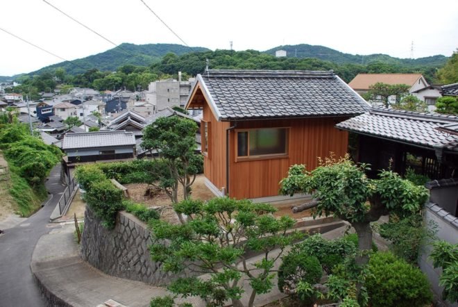 timber hut with black tiles