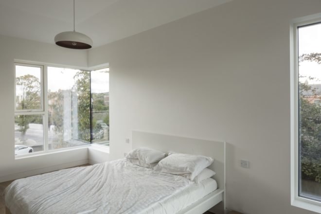 bedroom with white bed and sheets