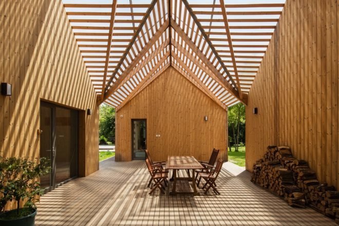 courtyard shaded by gabled, slatted timber roof