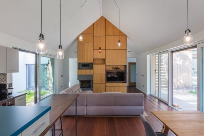 living room with section couch and tall vaulted ceiling