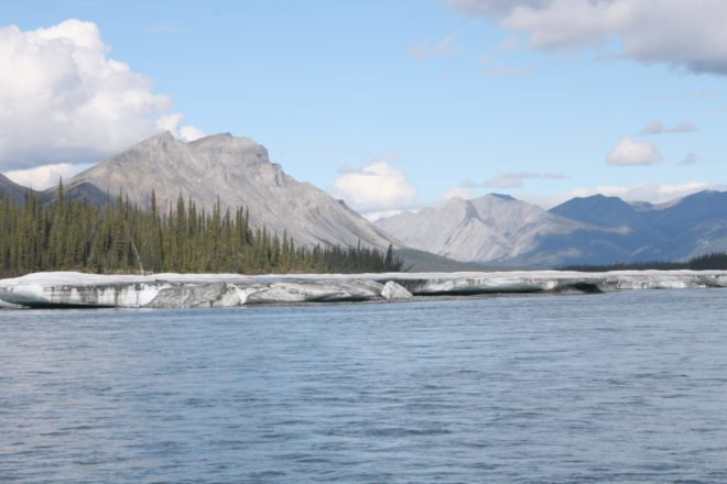 Mountains and trees near a river