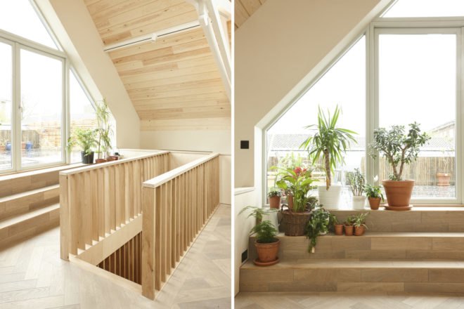 On the left, stairs to the mezzanine. On the right, roof terrace with plants.