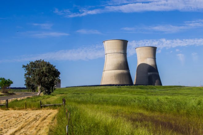 Old nuclear power plant near a farm