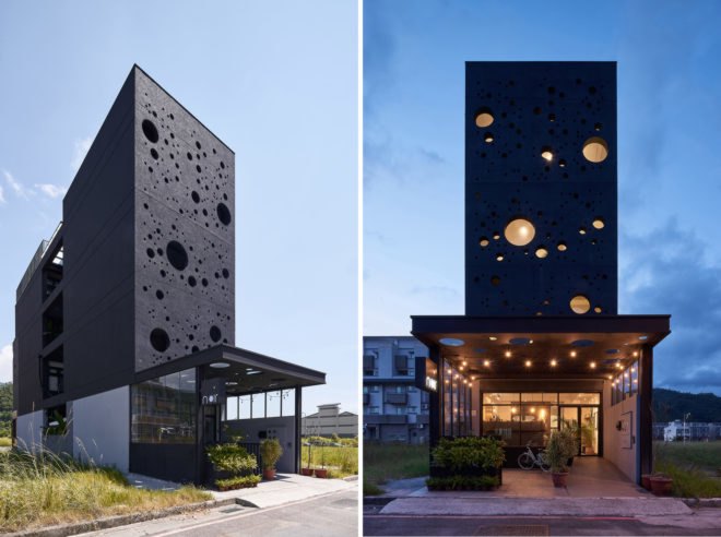 Tall black building with multiple round windows