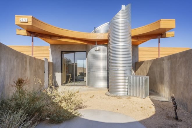 exterior of the side of the home with rounded corrugated metal