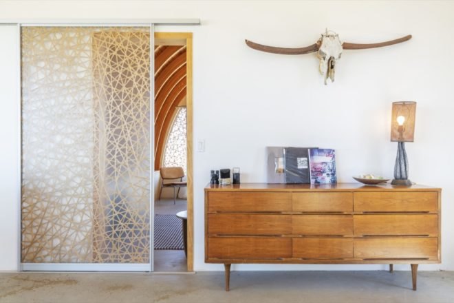 patterned glass door entrance to bedroom from the living room