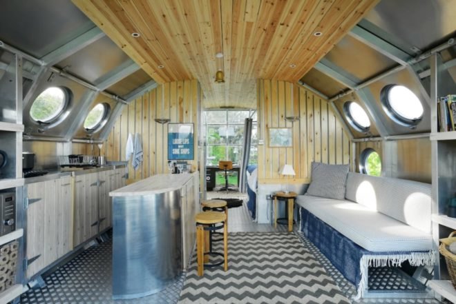 a curved interior covered in wooden panels