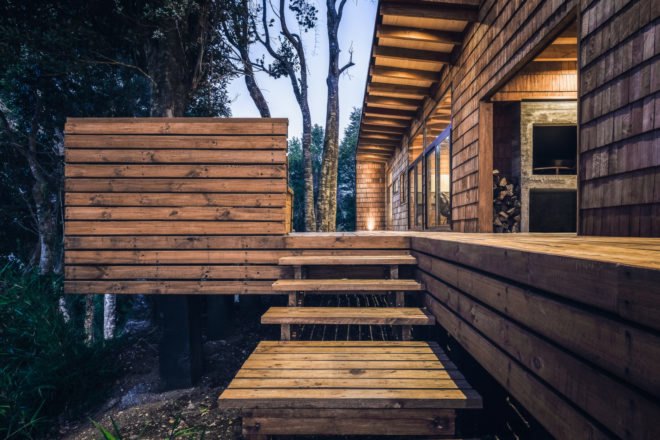 Stairs leading up to a large wooden deck