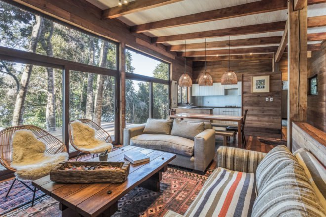 a rustic interior space with many windows