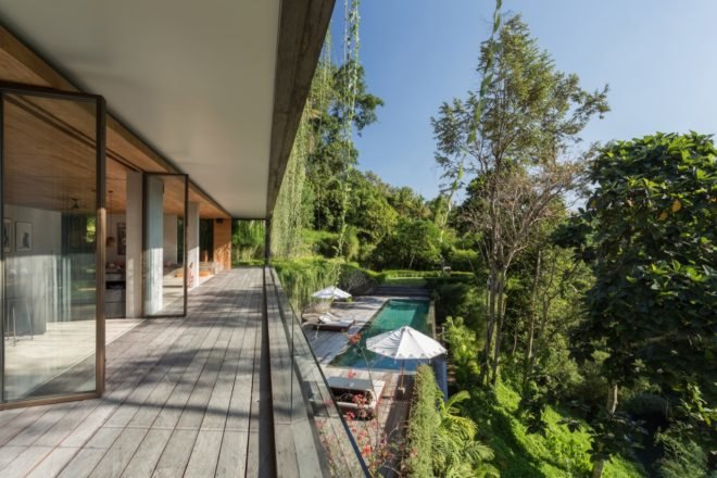 covered terrace with doors open to the inside of the home