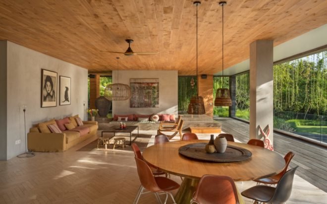 open plan dining and living area with wood table and light colored couch