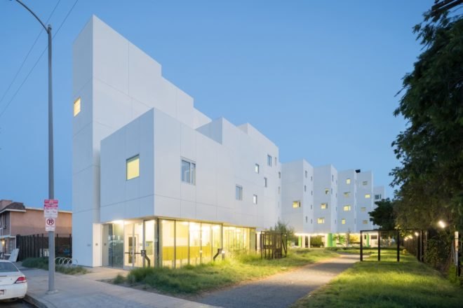 exterior view of white apartment building