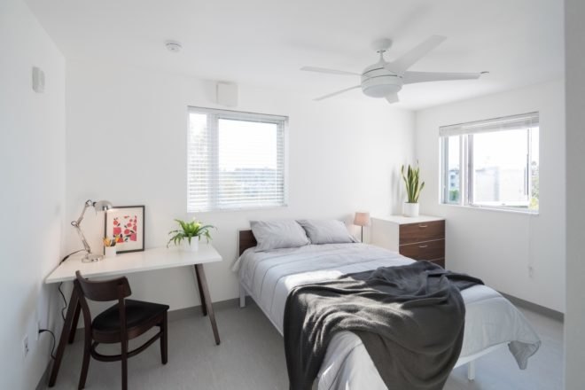 bedroom with table and window