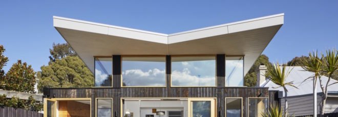 exterior of the extension with butterfly roof and dark timber cladding