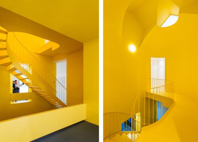 Bright yellow spiral staircase with bright yellow walls and ceilings