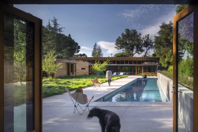 outdoor pool with yard and bungalow