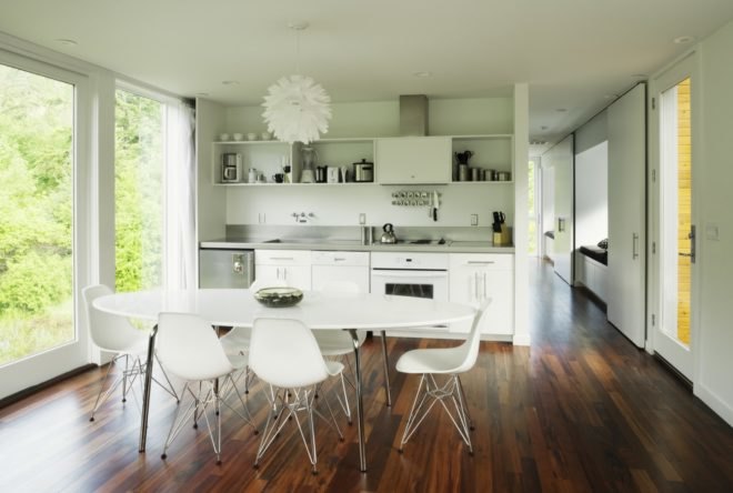 dining area with hardwood floor and white table