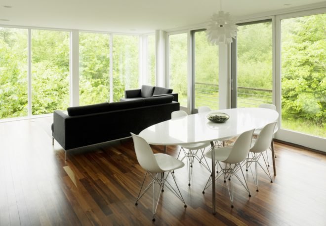 open plan living area with windows on all sides